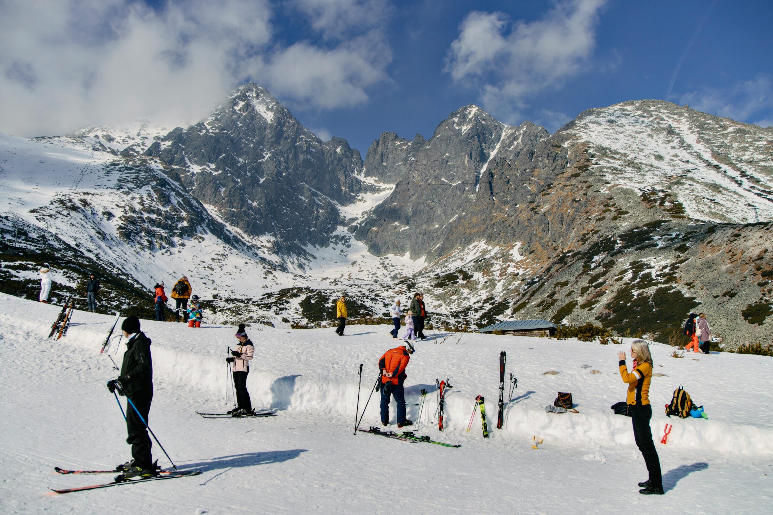 People skiing in the scenic High Tatras mountains of Slovakia, showcasing a winter wonderland.